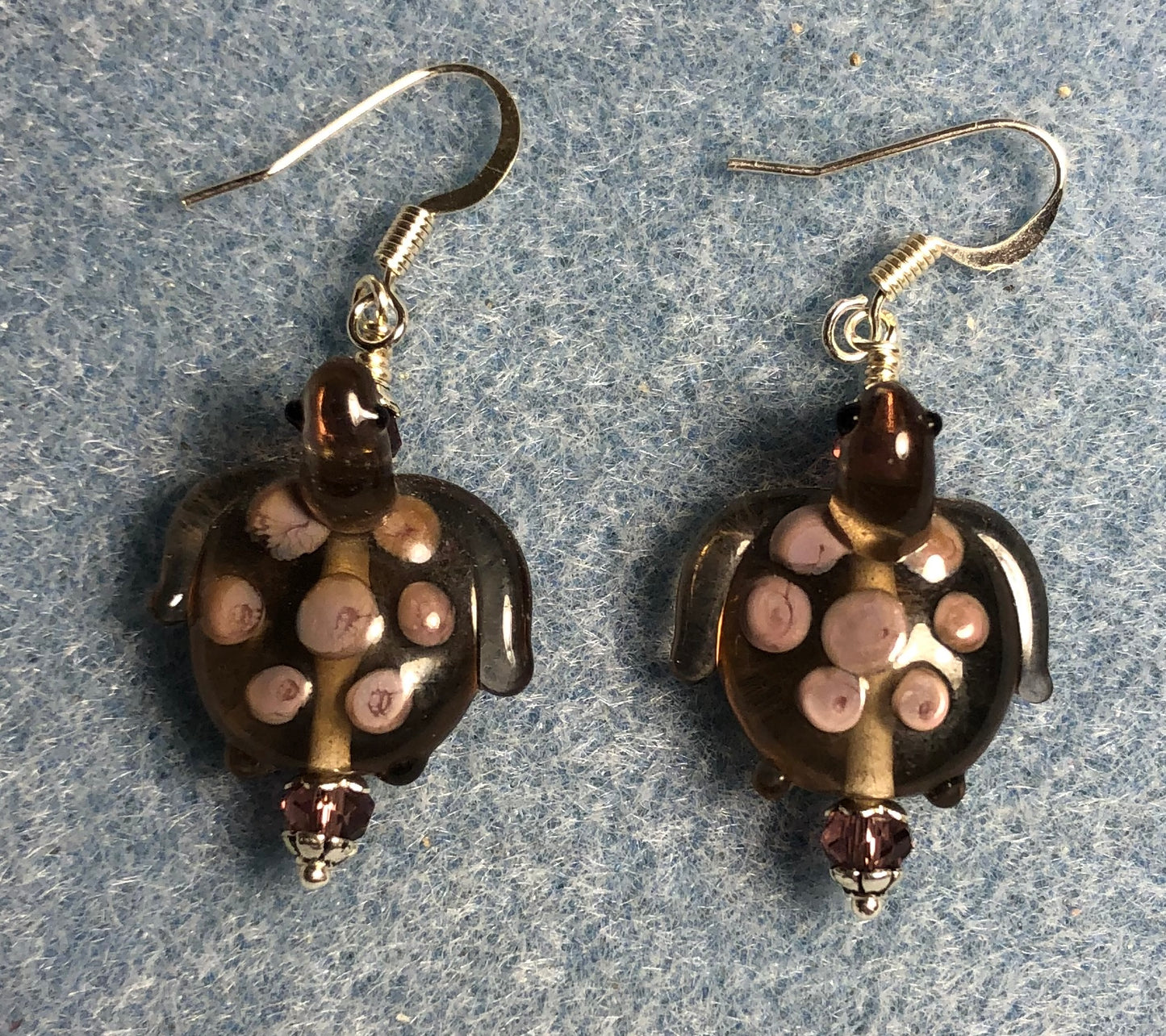 Purple with lavender spots lamp work turtle bead earrings adorned with purple Chinese crystal beads.