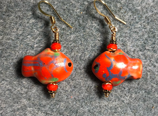 Orange and blue ceramic spotted fish bead earrings adorned with orange Chinese crystal beads.