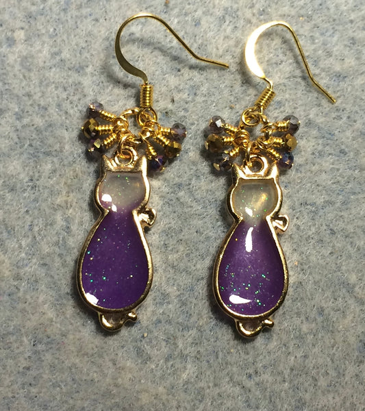 Purple and gold sparkly resin cat charm earrings adorned with small dangling purple and gold Chinese crystal beads.