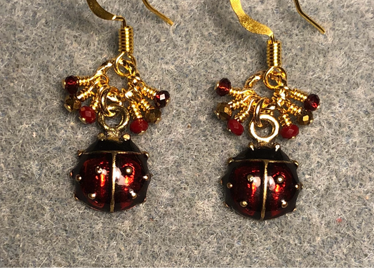 Small dark red and black enamel ladybug charm earrings adorned with tiny dangling dark red and gold Chinese crystal beads.