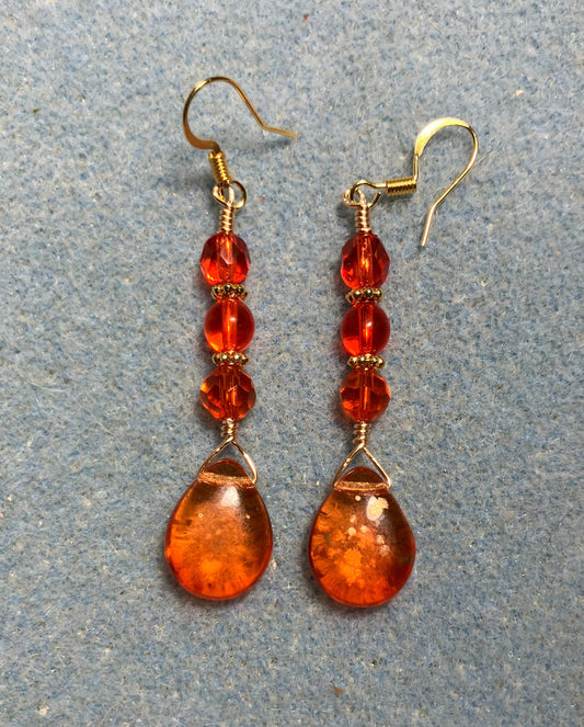 Orange gold dust Czech glass pear drop bead earrings adorned with orange Czech glass beads.