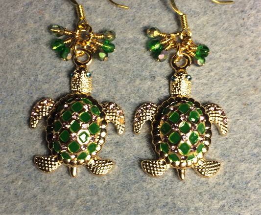 Large green and gold enamel and rhinestone turtle charm earrings adorned with tiny dangling green and gold Czech glass beads.