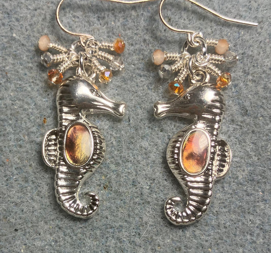 Silver and peach brown abalone seahorse charm earrings adorned with tiny dangling peach and silver Chinese crystal beads.