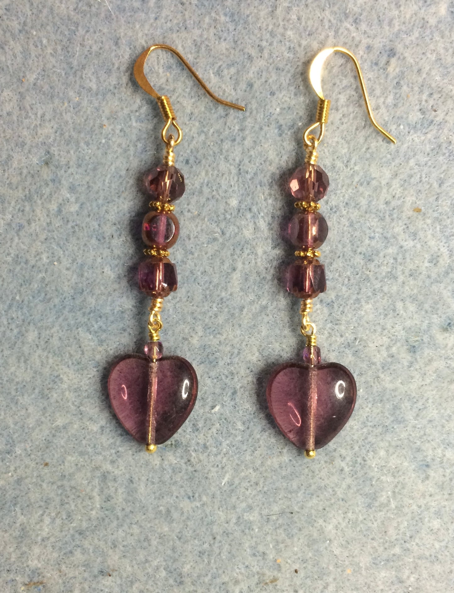 Violet Czech glass heart bead earrings adorned with violet Czech glass beads.