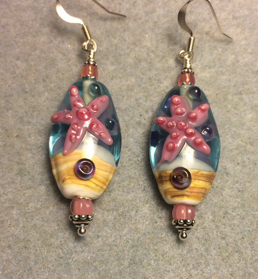 Turquoise, white, and pink lamp work starfish bead earrings adorned with pink Czech glass beads.