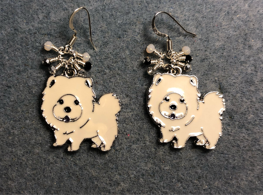 White enamel Chow dog charm earrings adorned with tiny dangling white, black, and silver Chinese crystal beads.