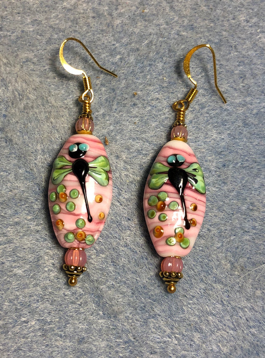 Pink and green lamp work dragonfly bead earrings adorned with pink Czech glass beads.
