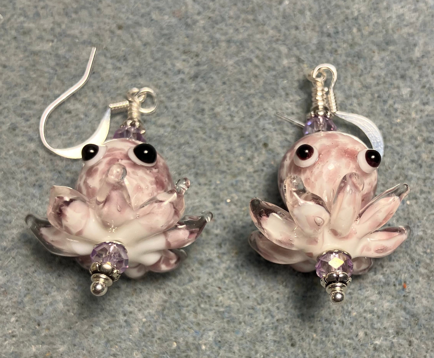 Light violet and white mottled lamp work octopus bead earrings adorned with light violet Chinese crystal beads.