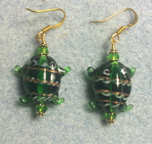 Emerald green lamp work frog bead earrings adorned with emerald green Chinese crystal beads.