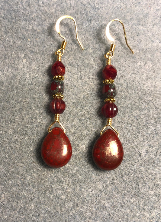 Bright red Czech glass pear drop bead earrings adorned with red Picasso Czech glass beads.