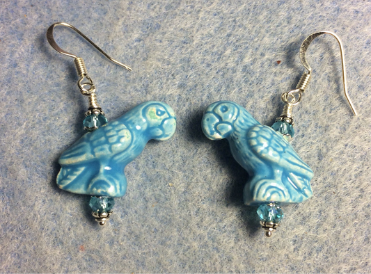 Turquoise ceramic parrot bead earrings adorned with turquoise Chinese crystal beads.