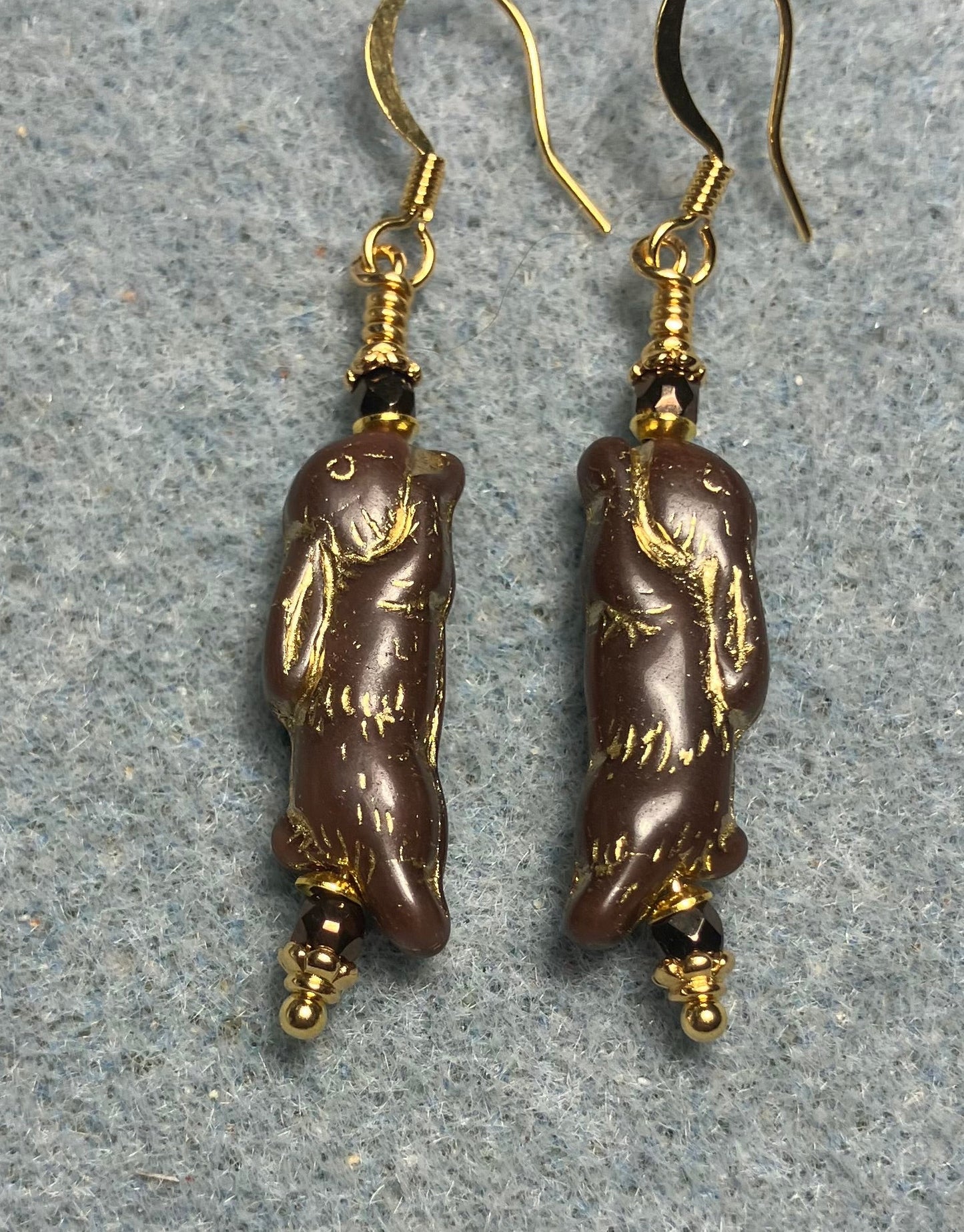 Small brown (with gold inlay) Czech glass bunny rabbit bead earrings adorned with small brown Czech glass beads.