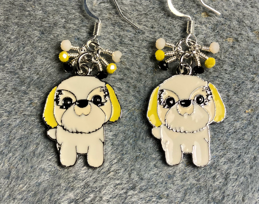 White and yellow enamel Shih Tzu charm earrings adorned with tiny dangling white, yellow, and black Chinese crystal beads.