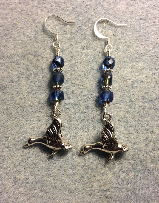 Silver flying geese charm earrings adorned with Montana blue Czech glass beads
