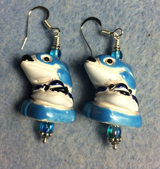 Large turquoise and white ceramic mother and baby dolphin bead earrings adorned with turquoise Czech glass beads.