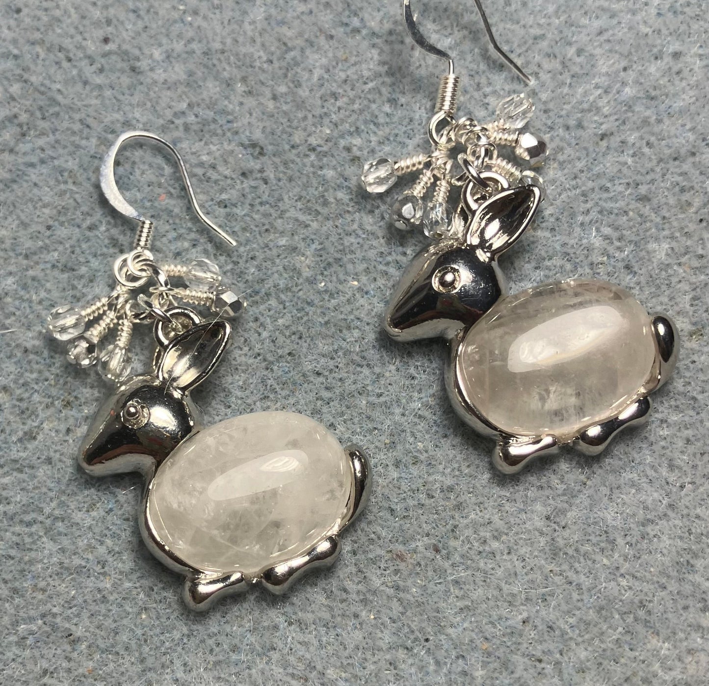 Large silver and rock crystal gemstone rabbit charm earrings adorned with small dangling clear and silver Czech glass beads.
