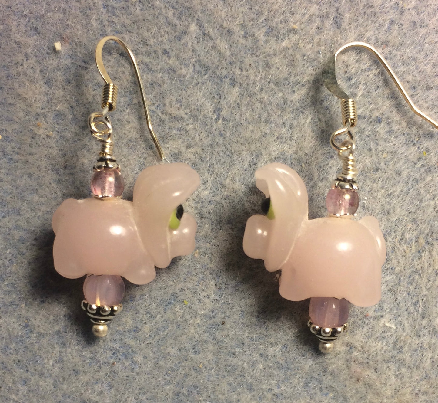 Light pink lamp work pig bead earrings adorned with pink Czech glass beads.