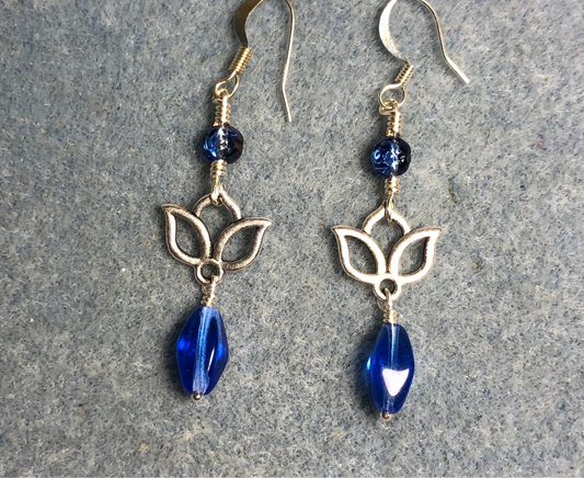 Small silver lotus flower connector charm earrings adorned with blue Czech glass drop beads and blue Czech glass rosebud beads.