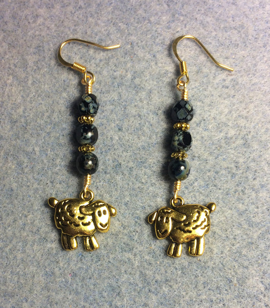 Gold sheep charm earrings adorned with black Picasso Czech glass beads