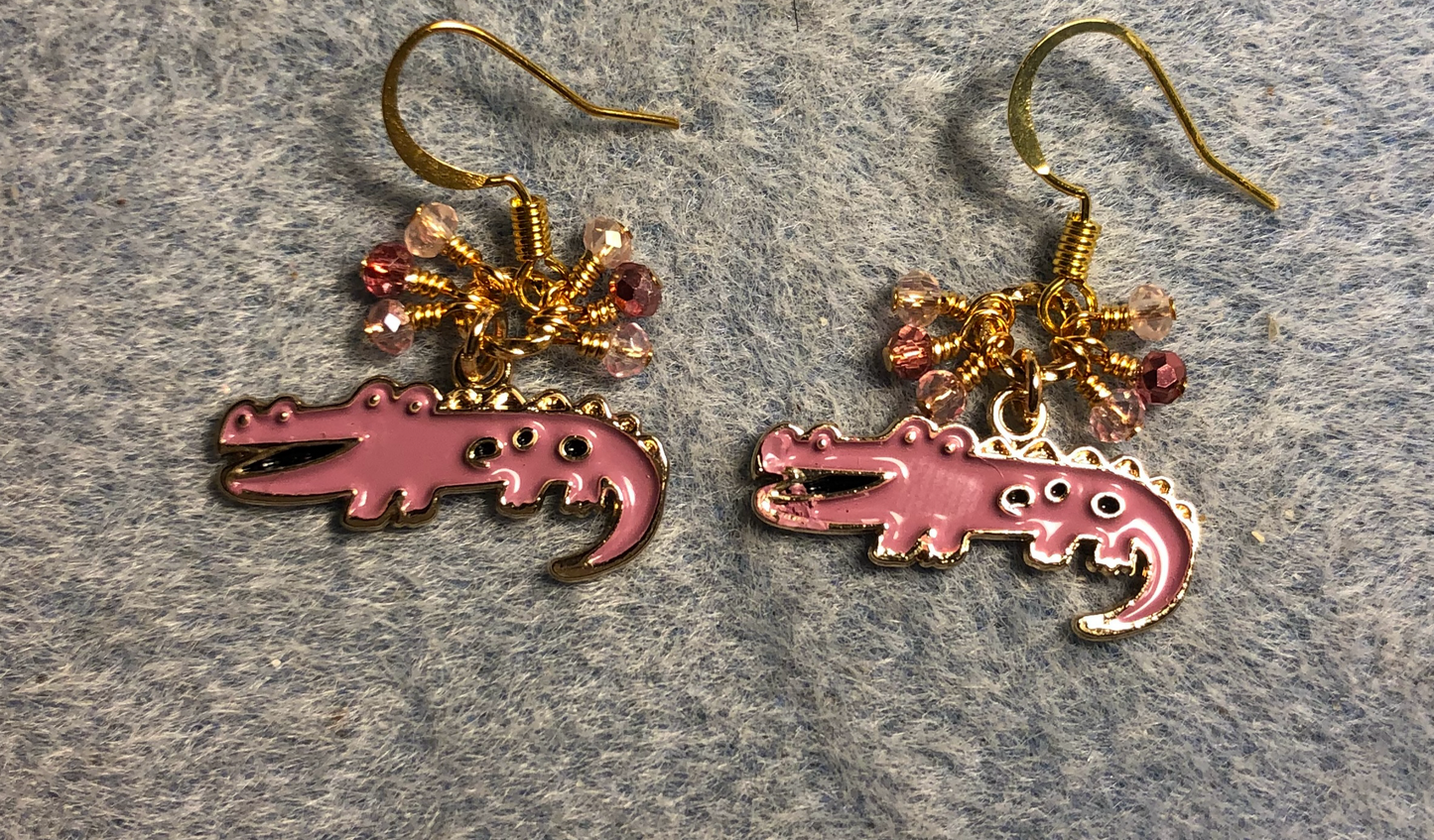 Mauve pink enamel alligator charm earrings adorned with tiny dangling mauve and pink Chinese crystal beads.