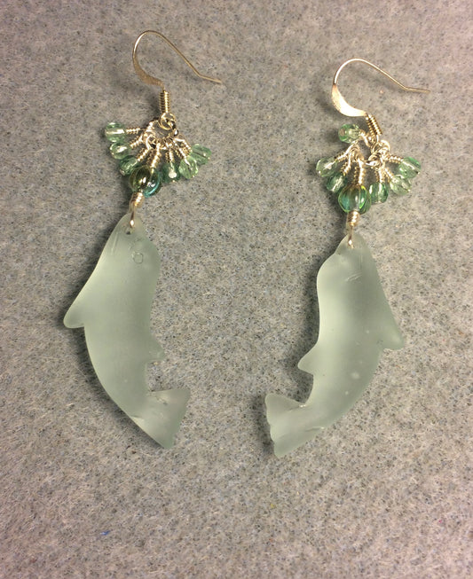 Light green sea glass dolphin pendant bead earrings adorned with light green Czech glass beads and tiny dangling light green Czech glass beads.