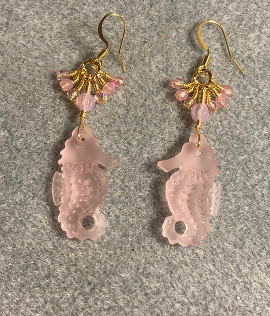 Pink sea glass seahorse pendant bead earrings adorned with pink Czech glass beads and tiny dangling pink Czech glass beads.