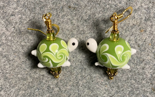 Lime green lamp work turtle bead earrings adorned with lime green Czech glass beads.