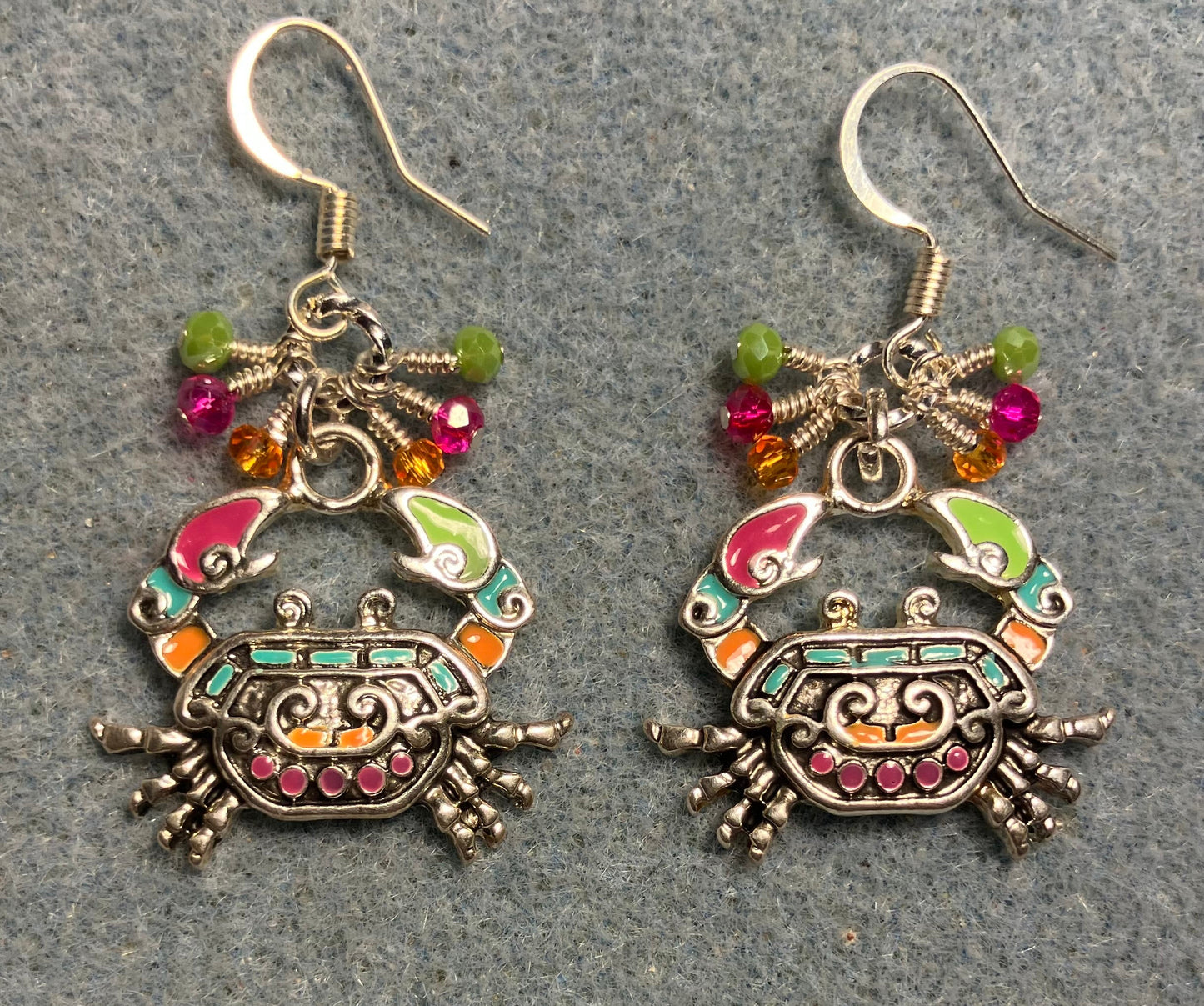 Orange, pink, and green enamel crab charm earrings adorned with tiny dangling orange, pink, and green Chinese crystal beads.