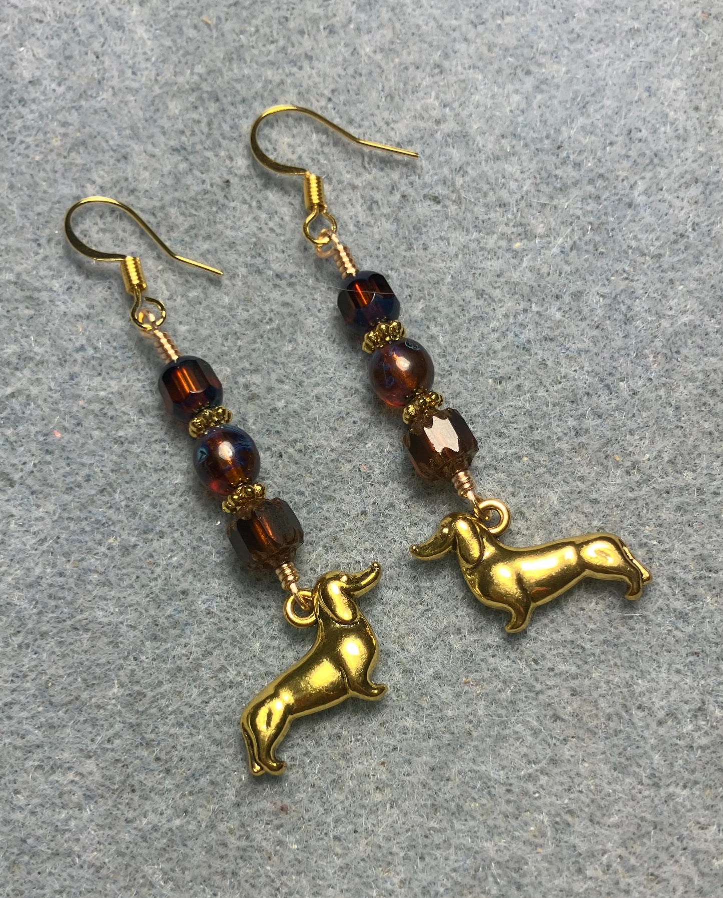 Gold dachshund charm earrings adorned with brown Czech glass beads