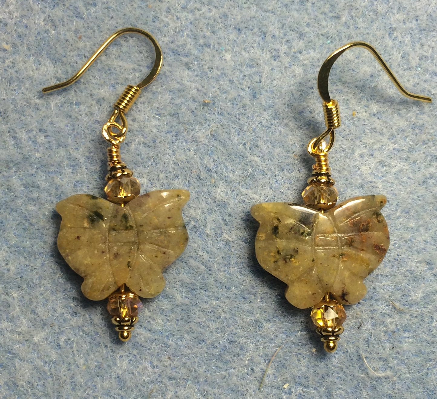 Tan quartz gemstone butterfly bead earrings adorned with amber Chinese crystal beads.