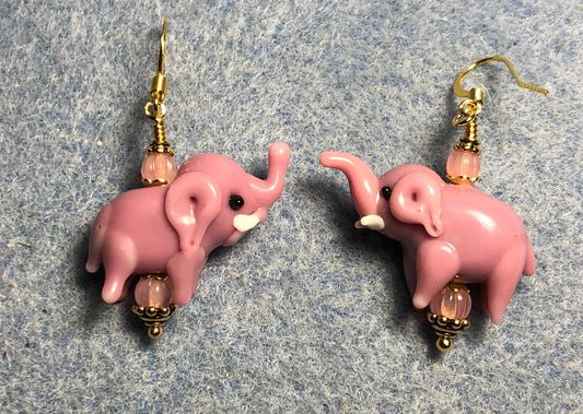 Opaque pink lamp work elephant bead earrings adorned with pink Czech glass beads.