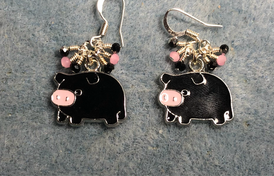 Black, pink, and silver enamel pig charm earrings adorned with tiny dangling black and pink Chinese crystal beads.