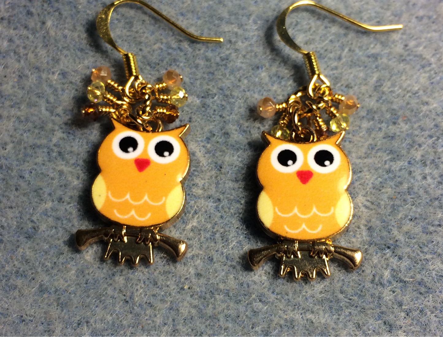 Orange, yellow, and white enamel owl charm earrings adorned with tiny dangling orange, yellow, and amber Chinese crystal beads.