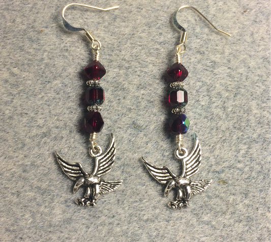 Silver flying hawk charm earrings adorned with ruby red Czech glass beads