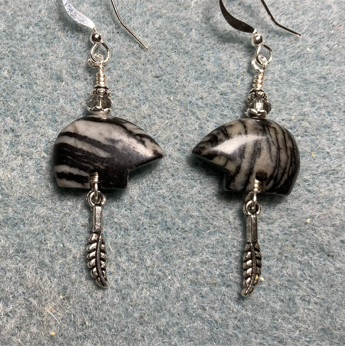 Picasso marble gemstone Zuni bear fetish bear earrings adorned with clear crystal beads and tiny silver feather charms.