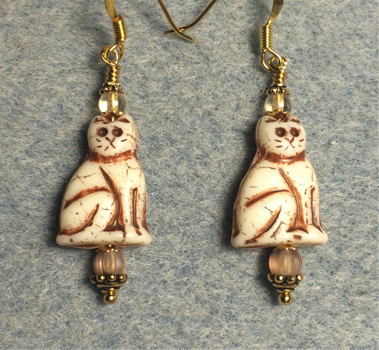 Opaque beige (with brown inlay) Czech glass cat bead earrings adorned with beige Czech glass beads.