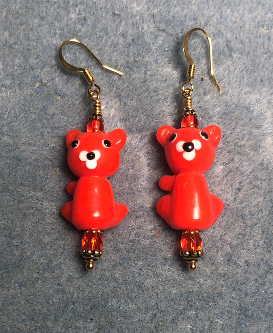 Orange lamp work cat bead earrings adorned with orange Czech glass beads.