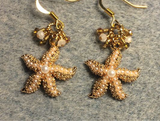 Gold and pearl starfish charm earrings adorned with tiny dangling amber and white Chinese crystal beads.