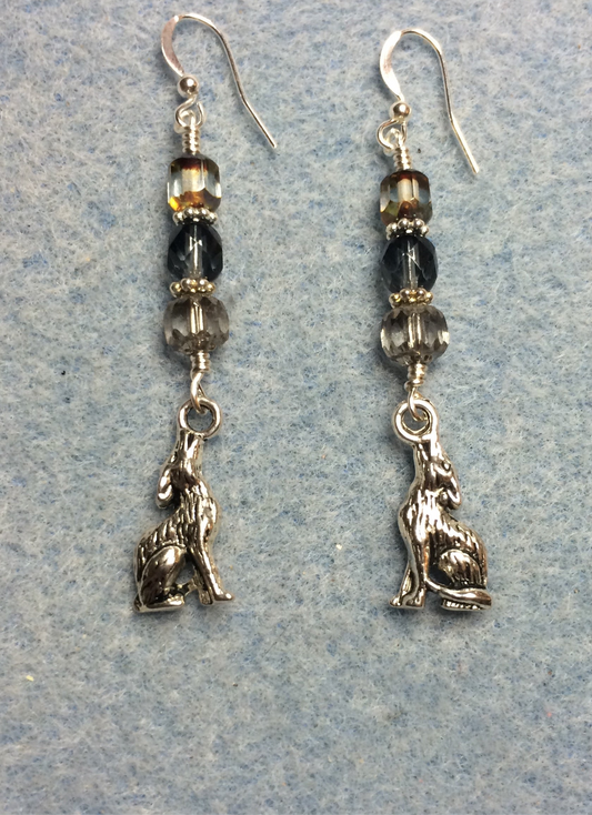 Silver howling coyote charm earrings adorned with gray and dark gray Czech glass beads.