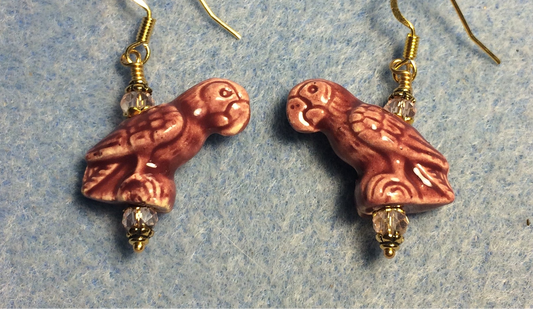 Rose pink ceramic parrot bead earrings adorned with pink Chinese crystal beads.