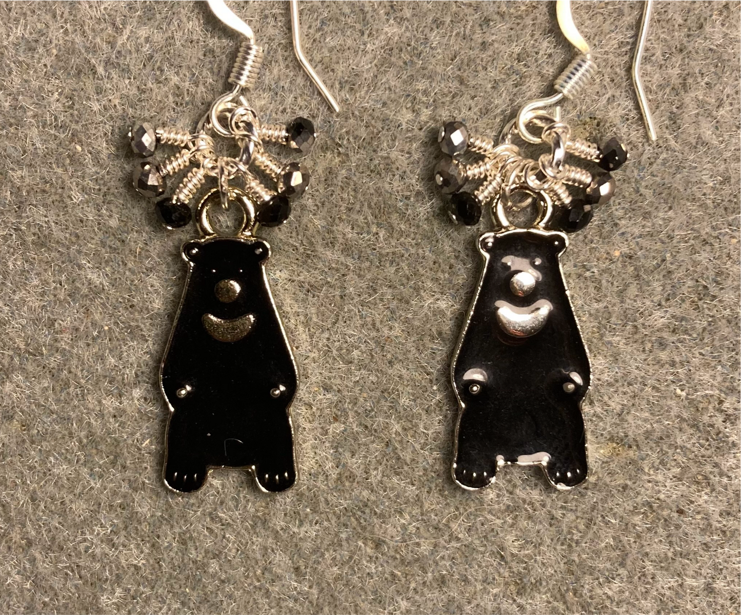 Black and silver enamel black bear charm earrings adorned with tiny dangling black and silver Chinese crystal beads.