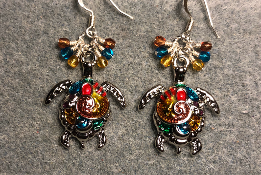 Colorful enamel sea turtle charm earrings adorned with small dangling turquoise, rose, and amber Czech glass beads.