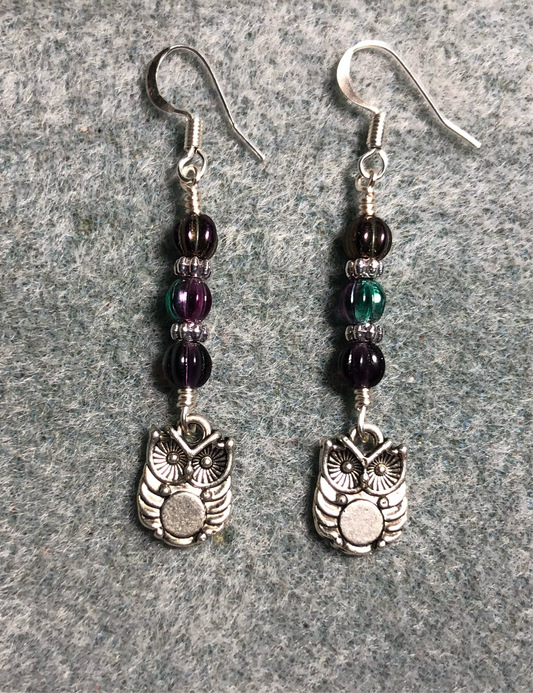 Small silver owl charm earrings adorned with purple Czech glass melon beads.