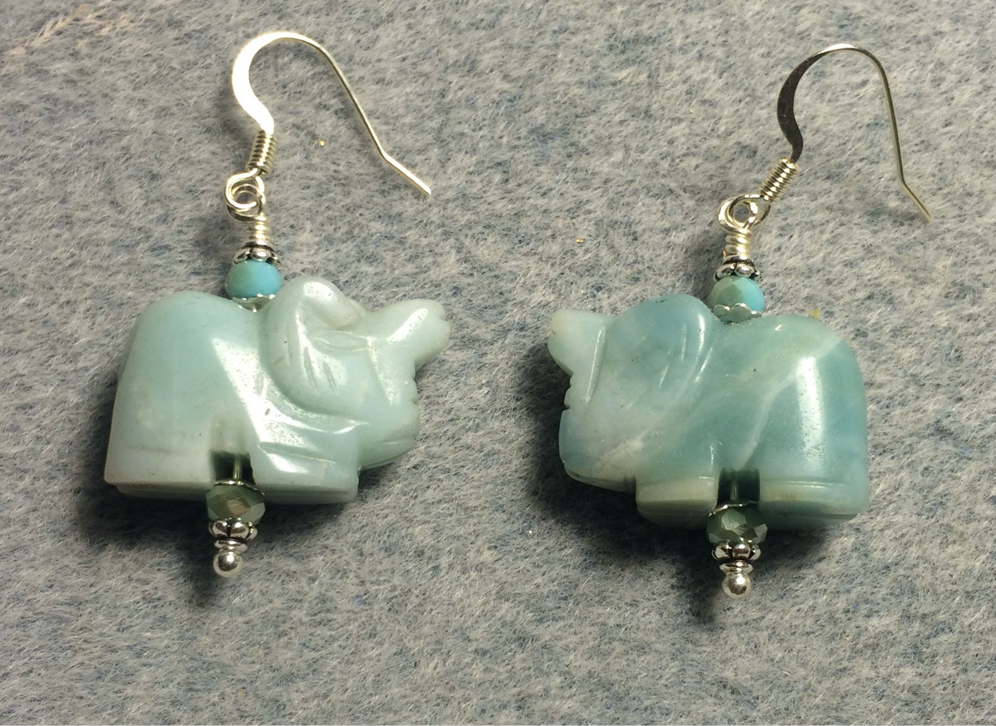 Turquoise amazonite gemstone elephant bead earrings adorned with turquoise Chinese crystal beads.