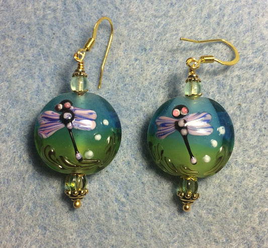 Green, turquoise, and purple lamp work dragonfly bead earrings adorned with green Czech glass beads.