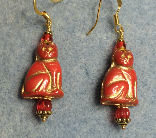 Red (with gold inlay) Czech glass cat bead earrings adorned with red Czech glass beads.