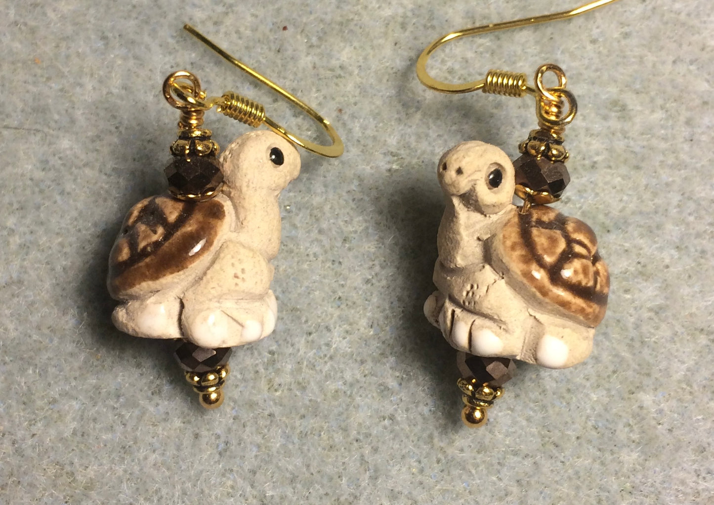 Medium tan and brown ceramic turtle bead earrings adorned with brown Chinese crystal beads.