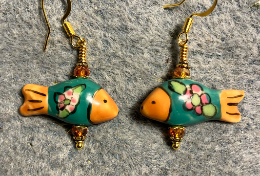 Dark green and tangerine ceramic fish bead earrings adorned with tangerine Chinese crystal beads.