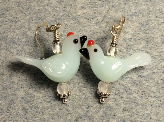 Milky white lamp work songbird bead earrings adorned with clear Czech glass beads.