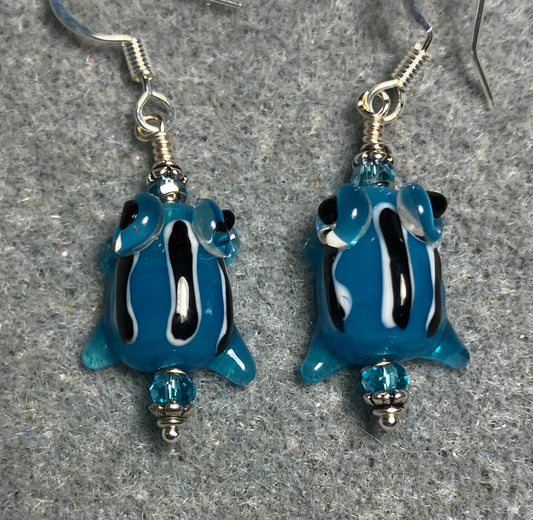 Very small turquoise with black stripes lamp work frog bead earrings adorned with turquoise Chinese crystal beads.